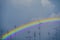 rainbow back on silhouette antennas on the dark sky