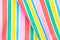 Rainbow backgrounds fabric. Closeup of rainbow textile with fresh colorful textured parallel vertical stripes. Abstract summer