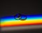 Rainbow beam on wedding rings. lgbt flag.