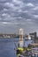 Rainbow Bridge with Cargo and cruise ships moored or sailing in Odaiba Bay of Tokyo