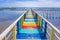 Rainbow bridge in Thailand.View of The colorful wood bridge extends into the sea under blue sky at samut sakhon province,Thailand