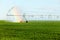 A rainbow caused by agricultural sprinkler system