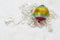 Rainbow Christmas ball with christmas chain on a white background.