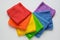 rainbow cloth patterns on white background, red, orange, yellow, green, blue and purple rags top view