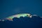 Rainbow clouds over a thundercloud in the evening