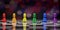 Rainbow color Chess pieces. Colorful chess pawns in a row on chessboard