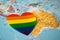 Rainbow color heart on Australia globe world map background, symbol of LGBT pride month