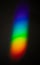 Rainbow color spectrum effect on wall, light scatter after hitting the glass object on to a dark wall