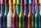 Rainbow Colored Bottles in a Row