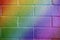 Rainbow colored brick texture closeup horizontal background.