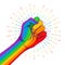 Rainbow colored hand with a fist raised up. Gay Pride. LGBT concept. Realistic style vector colorful illustration. Sticker, patch