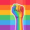 Rainbow colored hand with a fist raised up. Gay Pride. LGBT concept. Realistic style vector colorful illustration. Sticker, patch