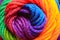 Rainbow colored macro of a spool of yarn