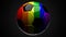 Rainbow colored soccer ball on black background.
