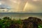 Rainbow colorful above sea horizon at dawn