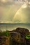 Rainbow colorful above sea horizon at dawn