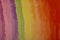 Rainbow colors on canvas, retail at a magnification