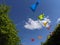 Rainbow coloured bunting flags flying in the sky