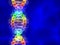 Rainbow DNA (deoxyribonucleic acid) on blue background