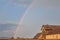 Rainbow in a field of Uljma, in the agricultural region of Banat, province of voivodina, in a field, with a barn in front