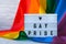 Rainbow flag with lightbox and text GAY PRIDE. Rainbow lgbtq flag made from silk material. Symbol of LGBTQ pride month