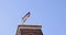 Rainbow flag with the word PACE (Peace in Italian) waving on the tower in Genoa, Italy. Support Ukraine concept