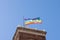 Rainbow flag with the word PACE Peace in Italian waving on the tower in Genoa, Italy. Support Ukraine concept