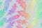 Rainbow fluffy feathers on a light gray background