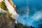 Rainbow at the foot of a waterfall falling into the sea from a cliff, Lower Duden, Antalya