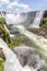 Rainbow, forest, waterfalls and river with rocks