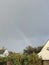 Rainbow forming in the sky