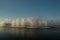 A rainbow formsfountains in a technical reservoir near a thermal power plant.  Industrial tourism, nice landscape