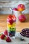 Rainbow fruit salad in glass.