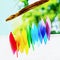 Rainbow glass wind chimes or windchime on nature background. Feng shui symbol. Copy space