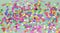 Rainbow glitters stats on colorful background.