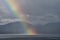 A rainbow going down on the Alaskan Sea