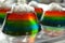 Rainbow Jello Shots with Whipped Cream and Sprinkles