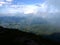 Rainbow between the land and clouds high in Carpathian Mountains