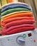 Rainbow laundry on washing machine