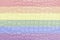 Rainbow LGBTQ or gay pride flag on crocodile leather texture. Abstract background