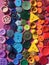 Rainbow made of sewing buttons background - stock photo