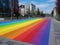 Rainbow markings on the pavement at a pedestrian crossing , View of rainbow pedestrian crossing, Gay Pride Crosswalk.