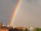 Rainbow multi color image in blue sky rain nature