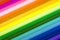 Rainbow multicolor pattern. Refills of a colored pens close-up. Blurred and defocused background