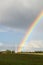 Rainbow near the energy generators at countryside.