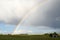 Rainbow near the energy generators at countryside.