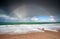 Rainbow over Atlantic ocean waves on coast