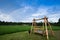 Rainbow over bamboo swing in garden