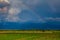 Rainbow over the cultivation fields and the majestic mountains of the Valle del Cauca region in Colombia