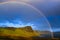 Rainbow over a dramatic coast of Scottish highlands, Isle of Sky